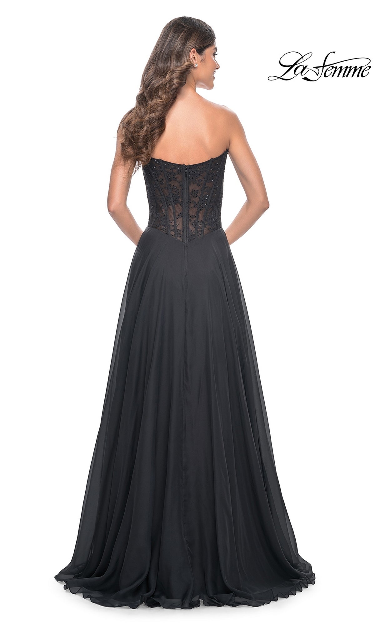 Woman wearing the La Femme Lace-Bodice Long A-Line Prom Dress 32311 with a strapless lace corset bodice and flowing chiffon skirt, shown from the back against a white background. Perfect for any formal event.